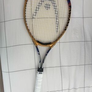 Head Tennis Racket with White Grip and Blue/gold Frame